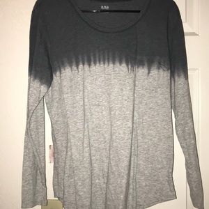 A grey and white long sleeve shirt